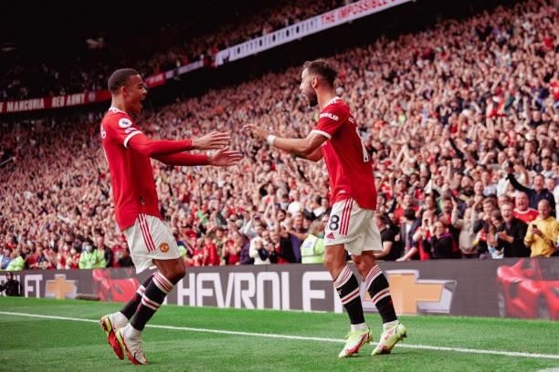 Bruno Fernandes of Manchester United celebrates scoring a goal to make the score 1-0 with Mason Greenwood during the Premier League match between...