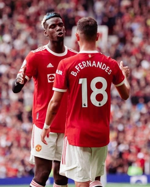 Bruno Fernandes of Manchester United celebrates scoring a goal to make the score 1-0 with Paul Pogba during the Premier League match between...
