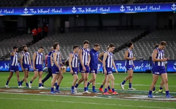 The Kangaroos look dejected after a loss during the 2021 AFL Round 22 match between the North Melbourne Kangaroos and the Sydney Swans at Marvel...