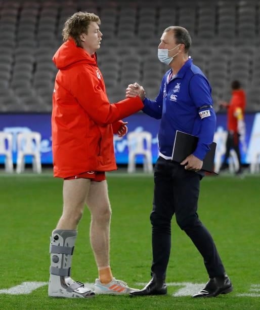 Nick Blakey of the Swans is embraced by father John after the 2021 AFL Round 22 match between the North Melbourne Kangaroos and the Sydney Swans at...