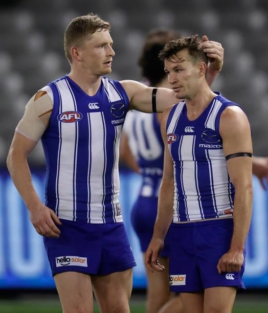 Jack Ziebell and Kayne Turner of the Kangaroos look dejected after a loss during the 2021 AFL Round 22 match between the North Melbourne Kangaroos...