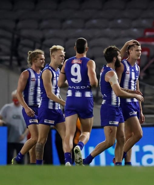 Charlie Comben of the Kangaroos celebrates his first league goal during the 2021 AFL Round 22 match between the North Melbourne Kangaroos and the...
