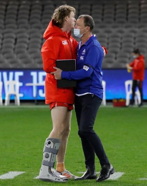 Nick Blakey of the Swans is embraced by father John after the 2021 AFL Round 22 match between the North Melbourne Kangaroos and the Sydney Swans at...