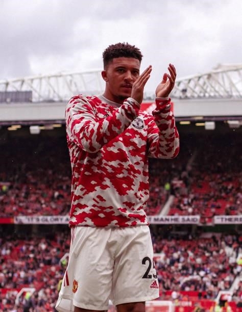 Jadon Sancho of Manchester United reacts to the fans prior to the Premier League match between Manchester United and Leeds United at Old Trafford on...