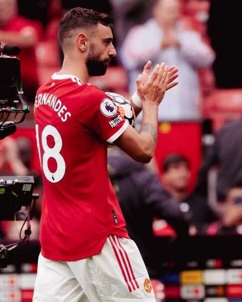 Bruno Fernandes of Manchester United applauds the fans at the end of the Premier League match between Manchester United and Leeds United at Old...