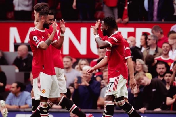 Bruno Fernandes of Manchester United celebrates with Fred during the Premier League match between Manchester United and Leeds United at Old Trafford...