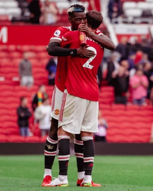 Paul Pogba of Manchester United hugs Victor Lindelof at the end of the Premier League match between Manchester United and Leeds United at Old...