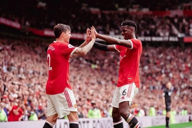 Victor Lindelof of Manchester United celebrates with team-mate Paul Pogba during the Premier League match between Manchester United and Leeds United...