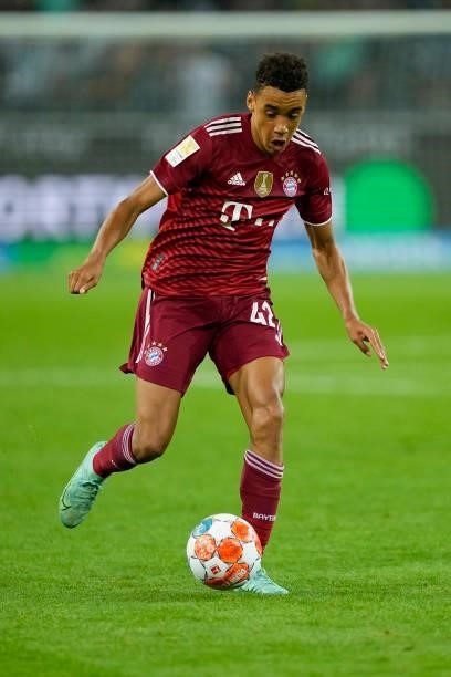 Jamal Musiala of Bayern Muenchen controls the ball during the Bundesliga match between Borussia Moenchengladbach and FC Bayern Muenchen at...