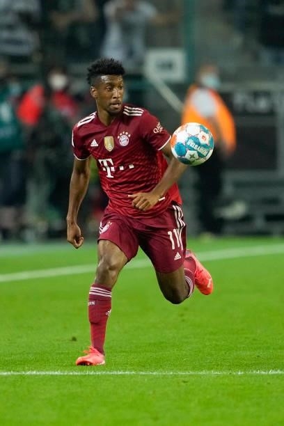 Kingsley Coman of Bayern Muenchen controls the ball during the Bundesliga match between Borussia Moenchengladbach and FC Bayern Muenchen at...