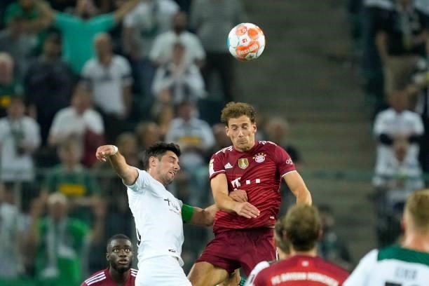 Lars Stindl of Borussia Moenchengladbach and Leon Goretzka of Bayern Muenchen battle for the ball during the Bundesliga match between Borussia...