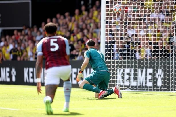 Tyrone Mings of Villa and goalkeeper Emiliano Martinez can only watch as the ball finds the net for the 2nd Watford goal during the Premier League...