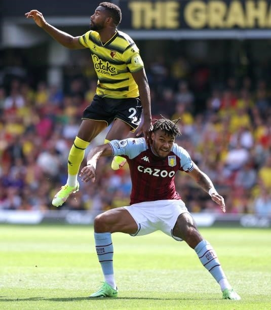 Emmanuel Dennis of Watford and Tyrone Mings of Villa during the Premier League match between Watford and Aston Villa at Vicarage Road on August 14,...