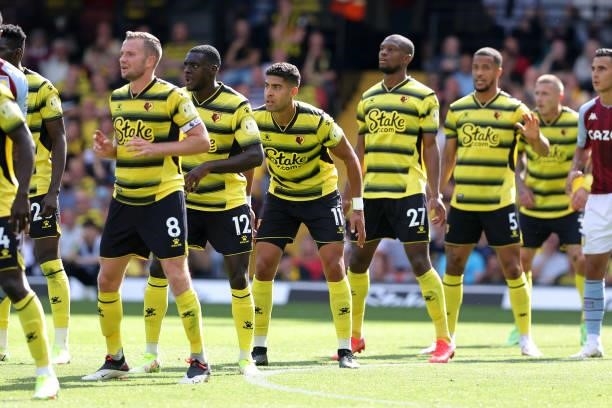 Tom Cleverley, Ken Sema, Adam Masina, Christian Kabasele and William Troost-Ekong of Watford line up for a free-kick during the Premier League match...