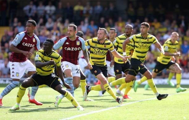 Danny Ings of Villa and Tom Cleverley of Watford track into the box during the Premier League match between Watford and Aston Villa at Vicarage Road...