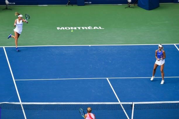 Bernarda Pera of the United States and Magda Linette of Poland play during their Womens Doubles Semifinals match against Darija Jurak of Croatia and...