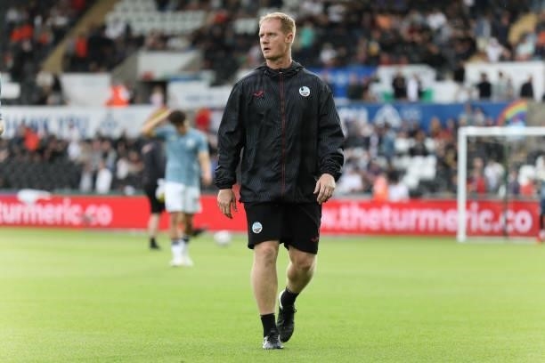 First team coach Alan Tate walks on the pitch prior the Sky Bet Championship match between Swansea City and Sheffield United at the Swansea.com...