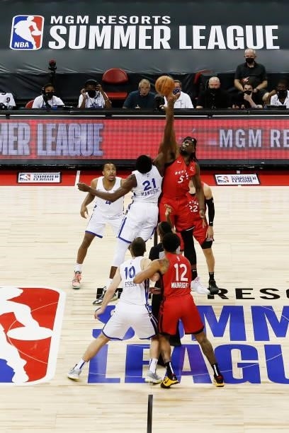 The Golden State Warriors and the Toronto Raptors tip off during the 2021 Las Vegas Summer League on August 11, 2021 at the Thomas & Mack Center in...