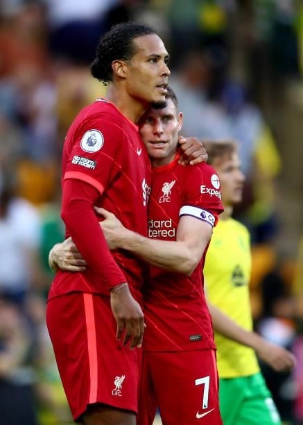 Virgil van Dijk embraces James Milner of Liverpool during the Premier League match between Norwich City and Liverpool at Carrow Road on August 14,...