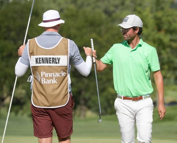 Billy Kennerly bump fist with caddie on the ninth green during the third round of the Korn Ferry Tours Pinnacle Bank Championship presented by Aetna...