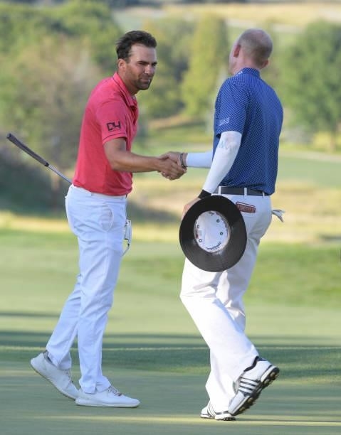 Curtis Thompson and Jared Wolfe shake hands on the 18th green during the third round of the Korn Ferry Tours Pinnacle Bank Championship presented by...