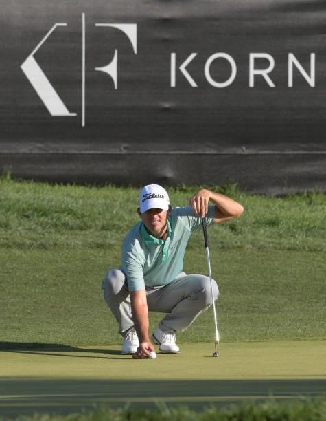 Wade Binfield lines his putt on the 18th green during the third round of the Korn Ferry Tours Pinnacle Bank Championship presented by Aetna at The...