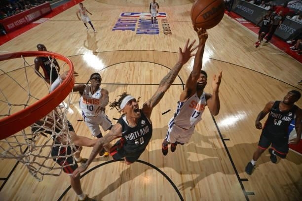 Michael Beasley of the Portland Trail Blazers and Kyle Alexander of the Phoenix Suns go after the rebound during the game during the 2021 Las Vegas...