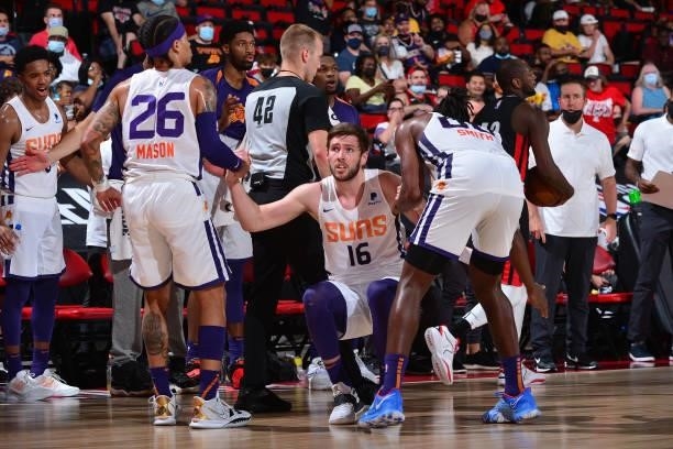 Jon Axel Gudmundsson of the Phoenix Suns is helped up by his teammates during the game against the Portland Trail Blazers during the 2021 Las Vegas...