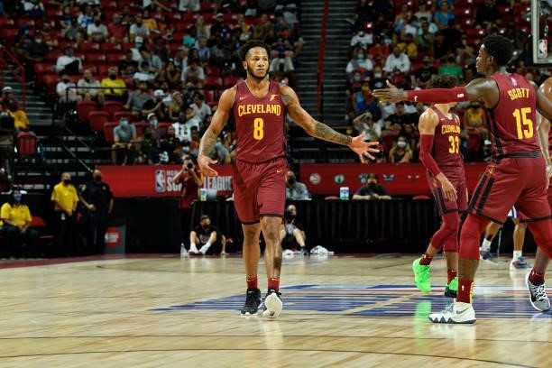Lamar Stevens high fives Tre Scott of the Cleveland Cavaliers during the game against the New York Knicks during the 2021 Las Vegas Summer League on...