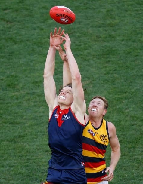 Ben Brown of the Demons and Kieran Strachan of the Crows compete for the ball during the 2021 AFL Round 22 match between the Melbourne Demons and the...