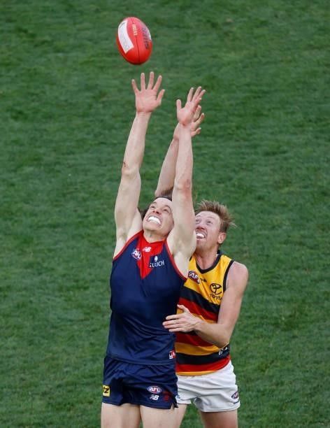 Ben Brown of the Demons and Kieran Strachan of the Crows compete for the ball during the 2021 AFL Round 22 match between the Melbourne Demons and the...
