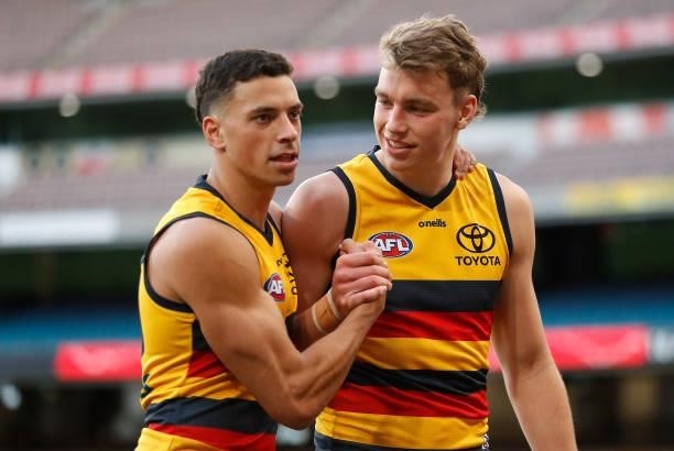 Ben Davis and Riley Thilthorpe of the Crows embrace during the 2021 AFL Round 22 match between the Melbourne Demons and the Adelaide Crows at the...