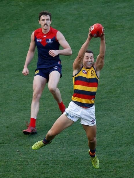 Tom Doedee of the Crows marks the ball during the 2021 AFL Round 22 match between the Melbourne Demons and the Adelaide Crows at the Melbourne...