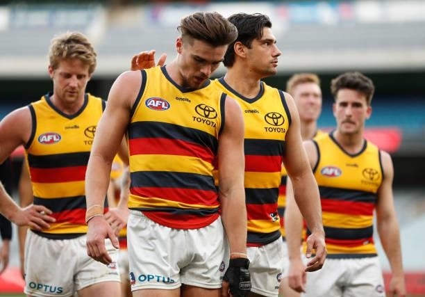 Ben Keays and Shane McAdam of the Crows react after a loss during the 2021 AFL Round 22 match between the Melbourne Demons and the Adelaide Crows at...