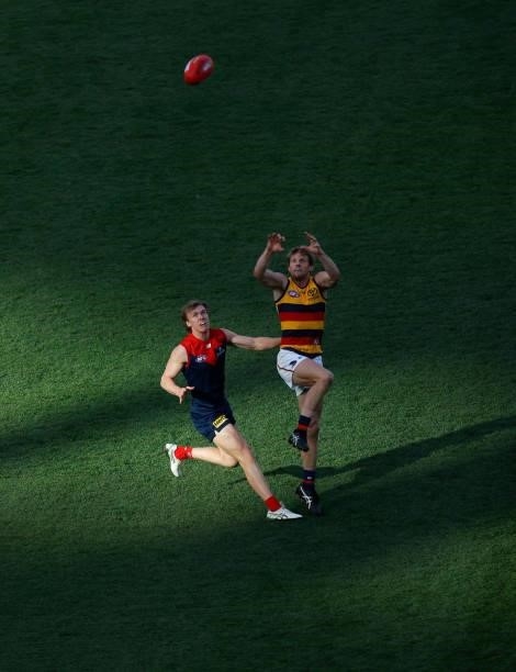 Rory Sloane of the Crows and James Jordon of the Demons compete for the ball during the 2021 AFL Round 22 match between the Melbourne Demons and the...