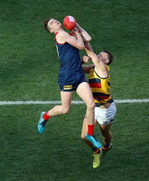 Bayley Fritsch of the Demons and Tom Doedee of the Crows compete for the ball during the 2021 AFL Round 22 match between the Melbourne Demons and the...