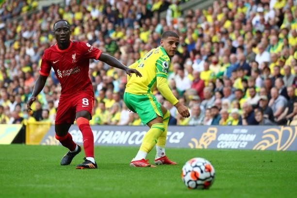 Naby Keita of Liverpool in action with Max Aarons of Norwich City during the Premier League match between Norwich City and Liverpool at Carrow Road...