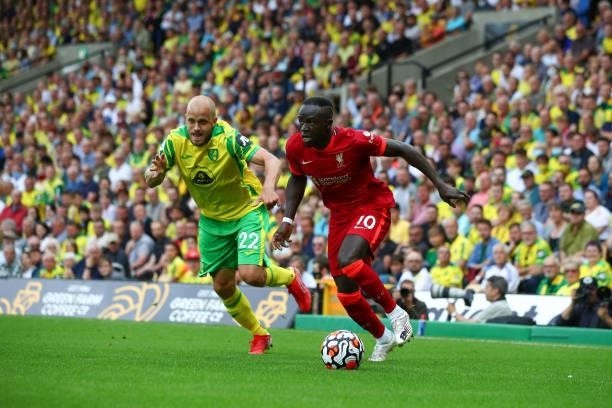 Sadio Mane of Liverpool in action with Teemu Pukki of Norwich City during the Premier League match between Norwich City and Liverpool at Carrow Road...