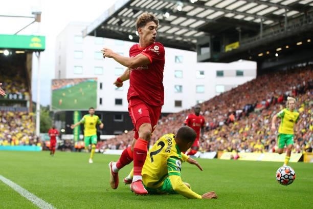 Kostas Tsimikas of Liverpool in action with Max Aarons of Norwich City during the Premier League match between Norwich City and Liverpool at Carrow...