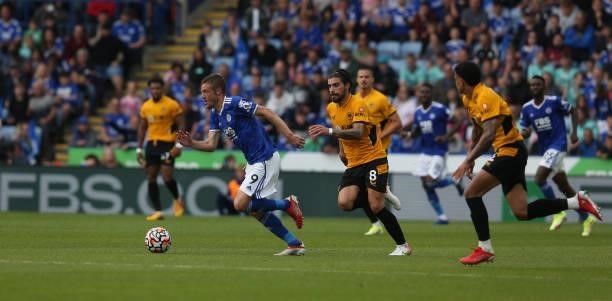 Leicester City's Jamie Vardy chased by Wolverhampton Wanderers' Ruben Neves during the Premier League match between Leicester City and Wolverhampton...