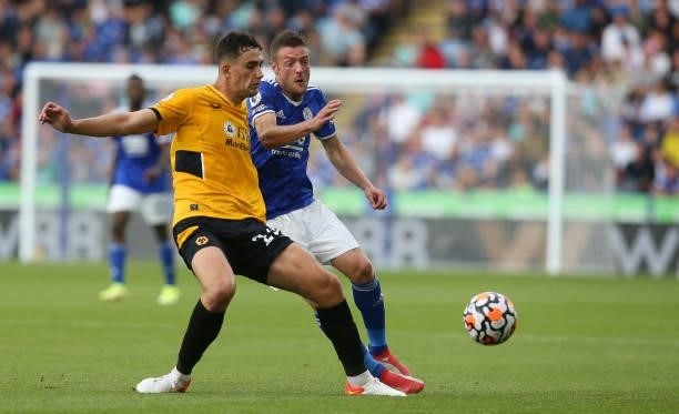 Leicester City's Jamie Vardy battles with Wolverhampton Wanderers' Max Kilman during the Premier League match between Leicester City and...