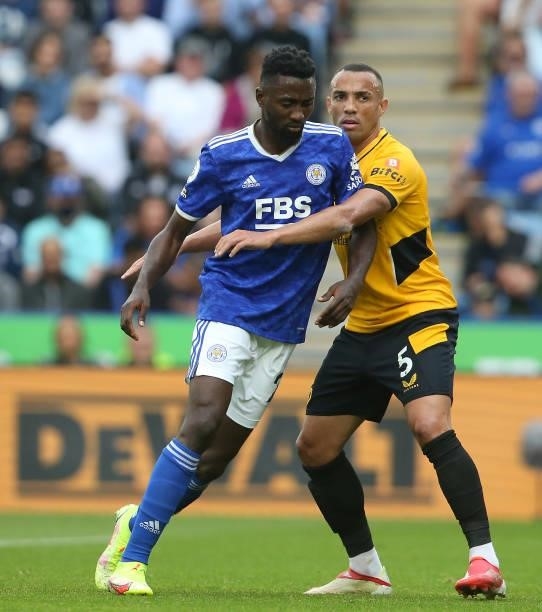 Leicester City's Wilfred Ndidi closely marked by Wolverhampton Wanderers' Fernando Marcal during the Premier League match between Leicester City and...