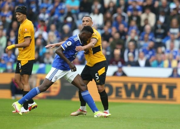Leicester City's Wilfred Ndidi closely marked by Wolverhampton Wanderers' Fernando Marcal during the Premier League match between Leicester City and...