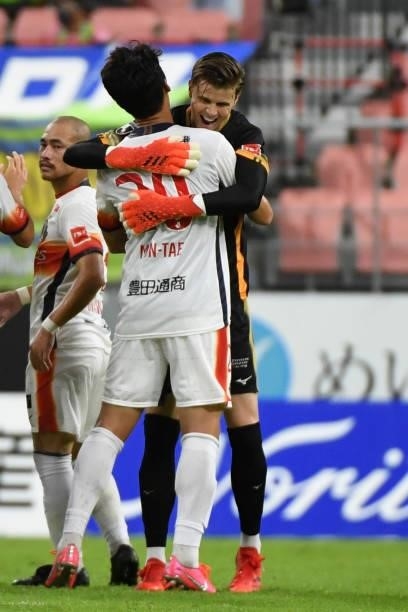 Langerak of Nagoya Grampus hugs Min Tae Kim of Nagoya Grampus who socores the winner during the J.League Meiji Yasuda J1 match between Nagoya Grampus...
