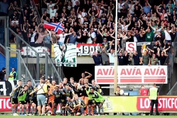 Feyenoord players celebrate victory with the fans during the Dutch Eredivisie match between Willem II and Feyenoord at the Koning Willem II stadium...