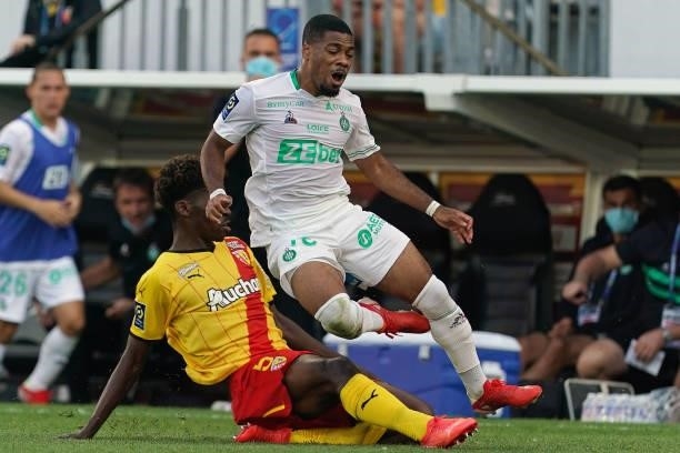 Arnaud Nordin of AS St-Etienne is challenged by Christopher Wooh of RC Lens during the Ligue 1 Uber Eats match between RC Lens and AS Saint Etienne...