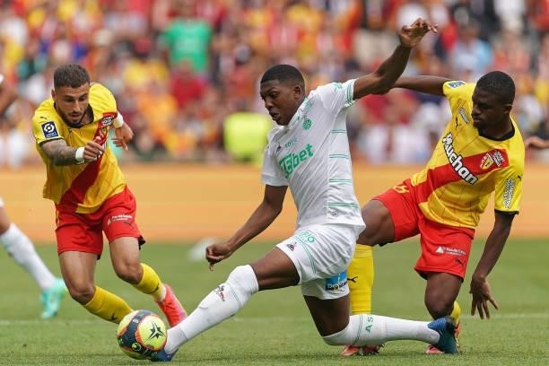 Zaydou Youssouf of AS St-Etienne competes for the ball with Jonathan Clauss of RC Lens and Cheick Doucoure of RC Lens during the Ligue 1 Uber Eats...