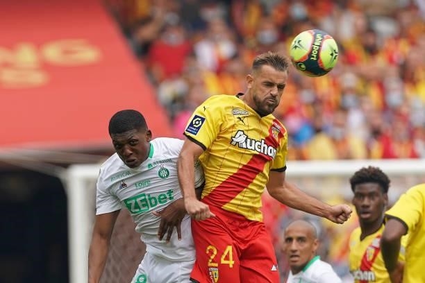 Zaydou Youssouf of AS St-Etienne competes for the ball with Jonathan Gradit of RC Lens during the Ligue 1 Uber Eats match between RC Lens and AS...
