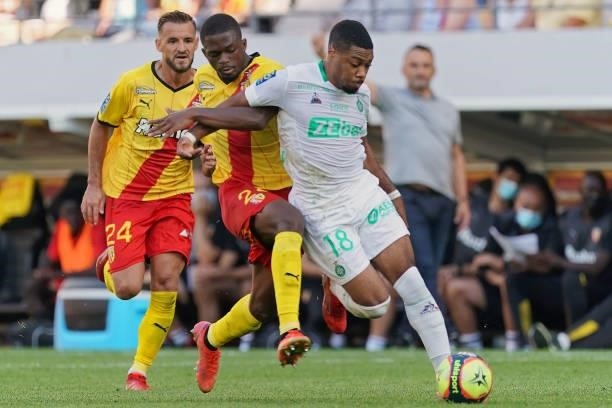 Arnaud Nordin of AS St-Etienne is challenged by Cheick Doucoure of RC Lens during the Ligue 1 Uber Eats match between RC Lens and AS Saint Etienne at...