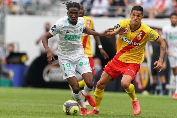 Yvan Neyou of AS St-Etienne competes for the ball with Florian Sotoca of RC Lens during the Ligue 1 Uber Eats match between RC Lens and AS Saint...